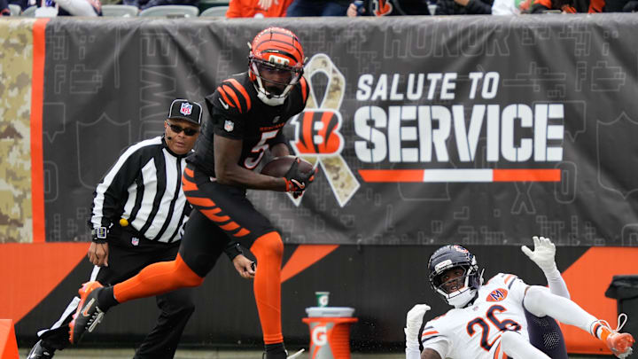 Bengals Tee Higgins (5) leaps to catch the ball and goes on to score a touchdown for the Bengals during their game against the Bears at Paycor Stadium on Sunday November 2, 2025.