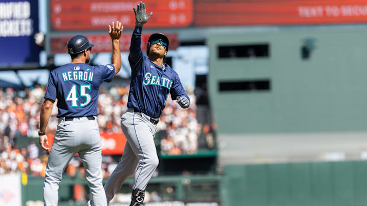 Seattle Mariners third base Jorge Polanco (right) celebrates after hitting a home run against the San Francisco Giants on April 4 at Oracle Park.