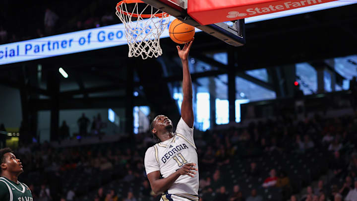 Dec 28, 2025; Atlanta, Georgia, USA; Georgia Tech Yellow Jackets forward Baye Ndongo (11) shoots against the Florida A&M Rattlers in the second half at McCamish Pavilion.