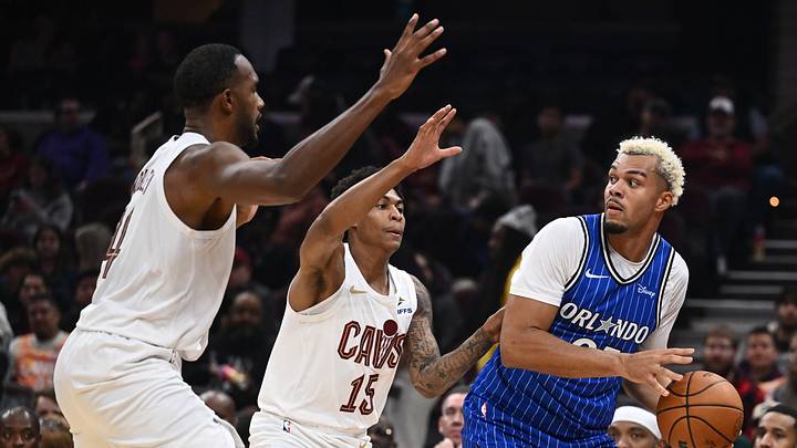 Oct 11, 2026; Cleveland, Ohio, USA; Cleveland Cavaliers center Evan Mobley (4) and guard Meleek Thomas (15) defend Orlando Magic forward Noah Penda (93) during the first half at Rocket Arena. Mandatory Credit: Ken Blaze-Imagn Images