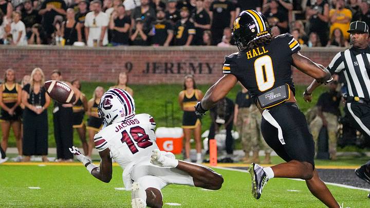 Sep 20, 2025; Columbia, Missouri, USA; South Carolina Gamecocks wide receiver Vandrevius Jacobs (19) makes a diving catch as Missouri Tigers cornerback Stephen Hall (0) looks on during the second half of the game at Faurot Field at Memorial Stadium. Mandatory Credit: Denny Medley-Imagn Images Sep 20, 2025; Columbia, Missouri, USA; South Carolina Gamecocks wide receiver Vandrevius Jacobs (19) makes a diving catch as Missouri Tigers cornerback Stephen Hall (0) looks on during the second half of the game at Faurot Field at Memorial Stadium. Mandatory Credit: Denny Medley-Imagn Images