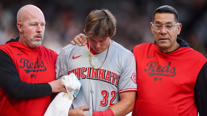 May 5, 2025; Atlanta, Georgia, USA; Cincinnati Reds left fielder Tyler Callihan (32) leaves the game with an injury against the Atlanta Braves in the third inning at Truist Park. Mandatory Credit: Brett Davis-Imagn Images May 5, 2025; Atlanta, Georgia, USA; Cincinnati Reds left fielder Tyler Callihan (32) leaves the game with an injury against the Atlanta Braves in the third inning at Truist Park. Mandatory Credit: Brett Davis-Imagn Images