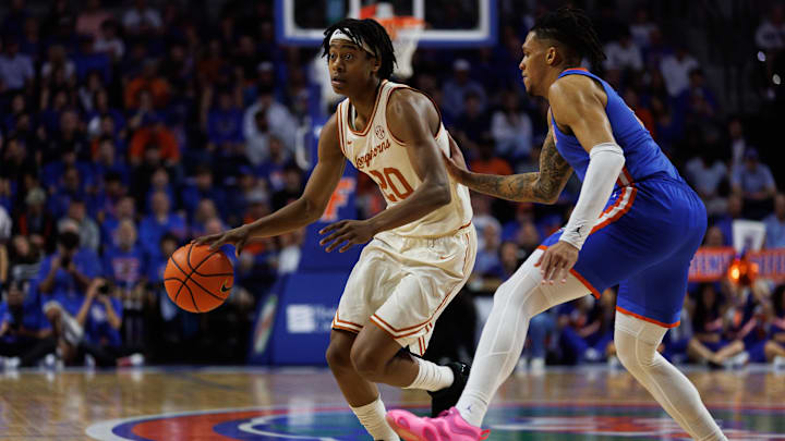 Jan 18, 2025; Gainesville, Florida, USA; Florida Gators guard Will Richard (5) defends Texas Longhorns guard Tre Johnson (20) during the first half at Exactech Arena at the Stephen C. O'Connell Center. Mandatory Credit: Matt Pendleton-Imagn Images