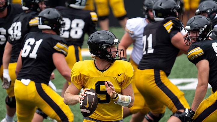 Iowa quarterback Hank Brown (9) looks to pass the football Aug. 15, 2026 during the Kids Day at Kinnick open practice at Kinnick Stadium in Iowa City, Iowa. Iowa quarterback Hank Brown (9) looks to pass the football Aug. 15, 2026 during the Kids Day at Kinnick open practice at Kinnick Stadium in Iowa City, Iowa.