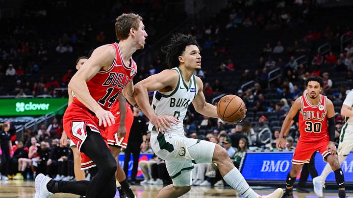 Oct 14, 2026; Milwaukee, Wisconsin, USA;  Milwaukee Bucks guard Brayden Burries (0) drives for the basket against Chicago Bulls forward Matas Buzelis (14) in the third quarter at Fiserv Forum.  Mandatory Credit: Benny Sieu-Imagn Images