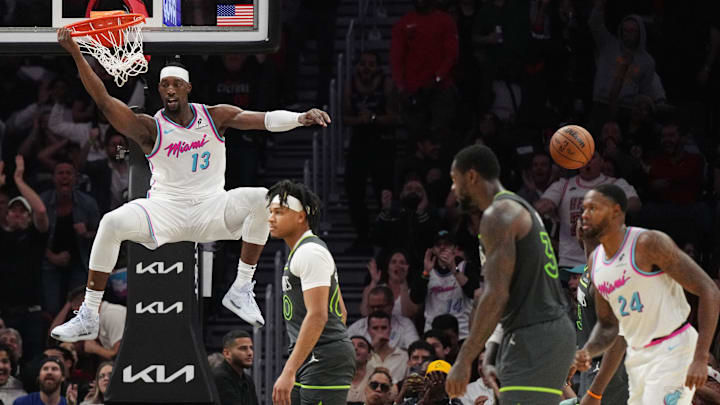 Mar 7, 2025; Miami, Florida, USA;  Miami Heat center Bam Adebayo (13) throws down a dunk causing Minnesota Timberwolves to call a timeout during the second half at Kaseya Center. Mandatory Credit: Jim Rassol-Imagn Images