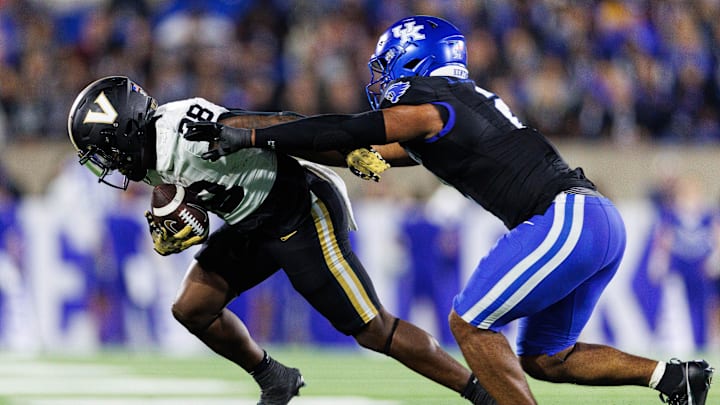 Oct 12, 2024; Lexington, Kentucky, USA; Kentucky Wildcats linebacker Jamon Dumas-Johnson (2) pushes Vanderbilt Commodores running back Sedrick Alexander (28) out of bounds during the fourth quarter at Kroger Field. Mandatory Credit: Jordan Prather-Imagn Images