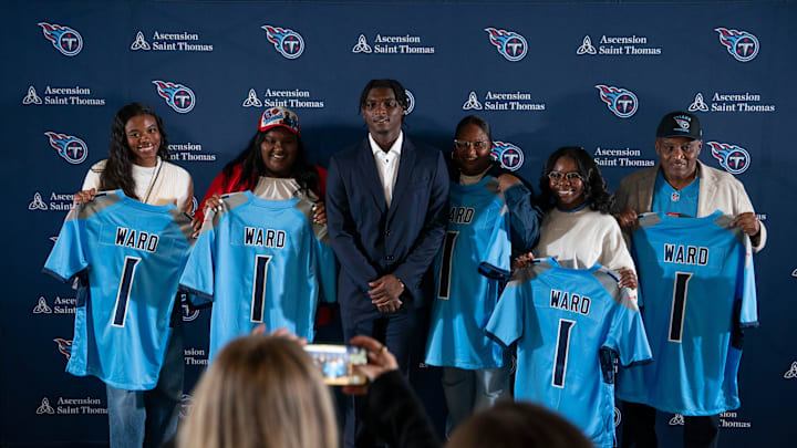 Cam Ward, center, poses for pictures with his family and girlfriend after being introduced as the Titans first-round pick