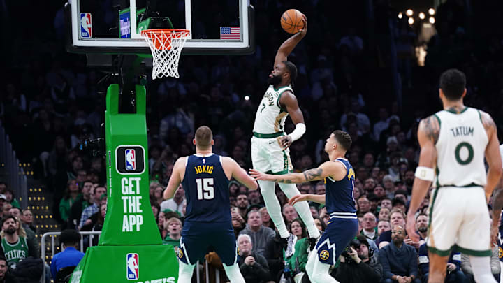 Jan 19, 2024; Boston, Massachusetts, USA; Boston Celtics guard Jaylen Brown (7) makes the basket against the Denver Nuggets in the second quarter at TD Garden. Mandatory Credit: David Butler II-Imagn Images