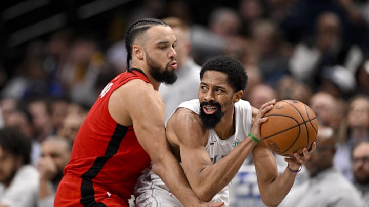 Feb 8, 2025; Dallas, Texas, USA; Dallas Mavericks guard Spencer Dinwiddie (26) looks to moves the ball past Houston Rockets forward Dillon Brooks (9) during the second half at the American Airlines Center. Mandatory Credit: Jerome Miron-Imagn Images