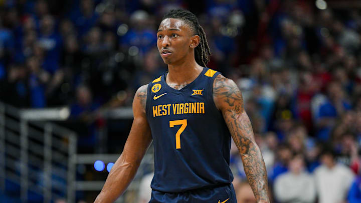 Dec 31, 2024; Lawrence, Kansas, USA; West Virginia Mountaineers guard Javon Small (7) reacts during the second half against the Kansas Jayhawks at Allen Fieldhouse. Mandatory Credit: Jay Biggerstaff-Imagn Images