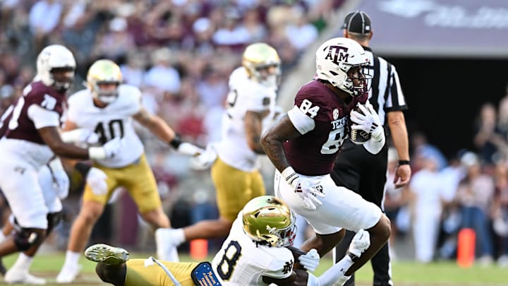 Aug 31, 2024; College Station, Texas, USA; Texas A&M Aggies wide receiver Blake Buntyn (84) runs the ball as Notre Dame Fighting Irish safety Adon Shuler (8) defends during the second quarter at Kyle Field. Mandatory Credit: Maria Lysaker-Imagn Images