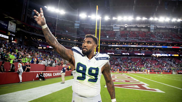 Dec 8, 2024; Glendale, Arizona, USA; Seattle Seahawks defensive end Leonard Williams (99) celebrates after defeating the Arizona Cardinals at State Farm Stadium. Mandatory Credit: Mark J. Rebilas-Imagn Images