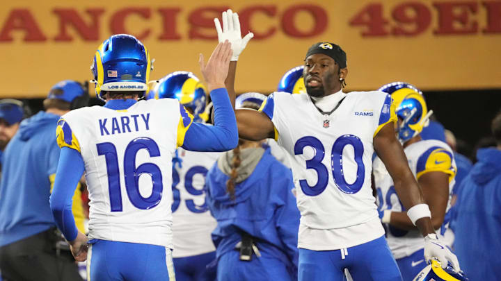 Dec 12, 2024; Santa Clara, California, USA; Los Angeles Rams kicker Joshua Karty (16) high fives cornerback Josh Wallace (30) after scoring a field goal against the San Francisco 49ers during the fourth quarter at Levi's Stadium. Mandatory Credit: Kelley L Cox-Imagn Images