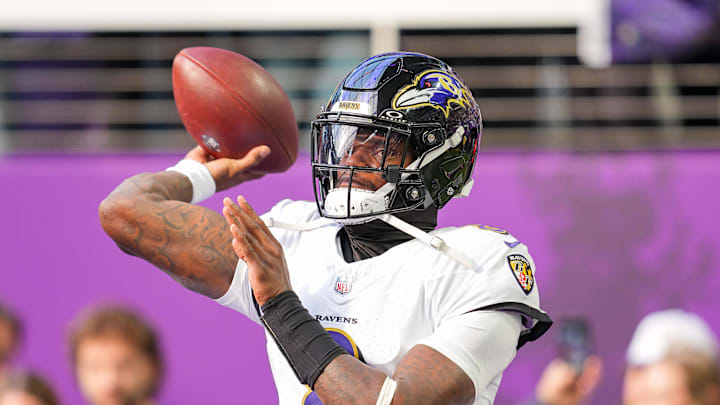Nov 9, 2025; Minneapolis, Minnesota, USA; Baltimore Ravens quarterback Lamar Jackson (8) warms up before the game against the Minnesota Vikings at U.S. Bank Stadium. Mandatory Credit: Brad Rempel-Imagn Images