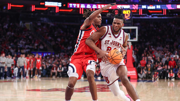 Dec 6, 2025; New York, New York, USA; St. John's basketball forward Zuby Ejiofor (24) looks to post up against Mississippi Rebels guard Eduardo Klafke (8) in the second half at Madison Square Garden. Dec 6, 2025; New York, New York, USA; St. John's basketball forward Zuby Ejiofor (24) looks to post up against Mississippi Rebels guard Eduardo Klafke (8) in the second half at Madison Square Garden.