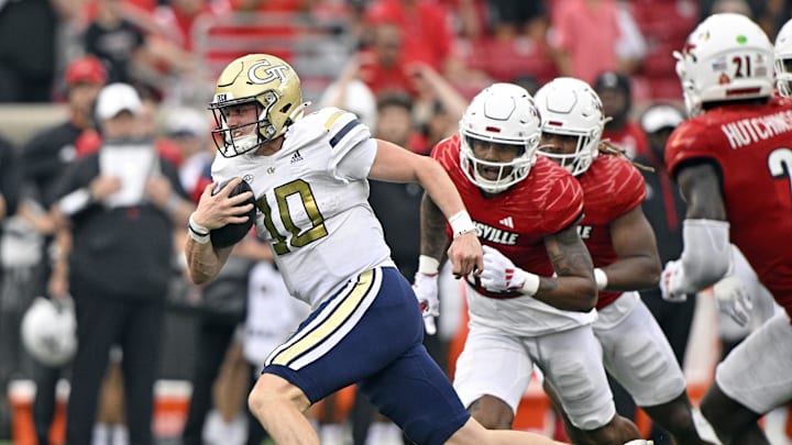 Sep 21, 2024; Louisville, Kentucky, USA;  Georgia Tech Yellow Jackets quarterback Haynes King (10) runs the ball against the Louisville Cardinals during the second half at L&N Federal Credit Union Stadium. Mandatory Credit: Jamie Rhodes-Imagn Images