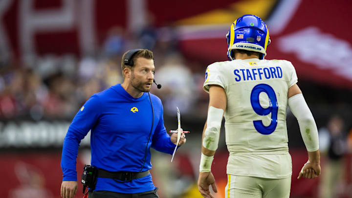 Nov 26, 2023; Glendale, Arizona, USA; Los Angeles Rams head coach Sean McVay talks with quarterback Matthew Stafford (9) against the Arizona Cardinals at State Farm Stadium. Mandatory Credit: Mark J. Rebilas-Imagn Images