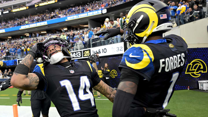 Nov 16, 2025; Inglewood, California, USA;  Los Angeles Rams cornerback Cobie Durant (14) celebrates with cornerback Emmanuel Forbes (1) after an interception against the Seattle Seahawks at SoFi Stadium. Mandatory Credit: Jayne Kamin-Oncea-Imagn Images