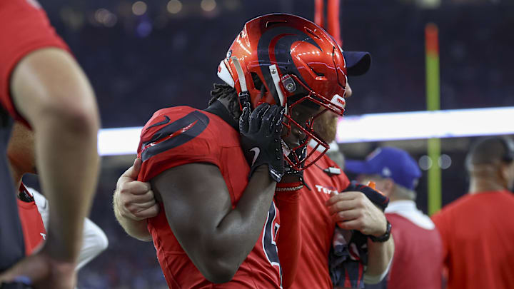Nov 10, 2024; Houston, Texas, USA; Houston Texans cornerback Kamari Lassiter (4) walks off the field after an apparent injury during the third quarter against the Detroit Lions at NRG Stadium. Mandatory Credit: Troy Taormina-Imagn Images