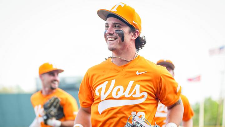 Tennessee's Reese Chapman (13) smiles as he runs back to the dugout after making a catch at the wall during a college baseball game between Tennessee and LSU at Lindsey Nelson Stadium in Knoxville, Tennessee., on April 3, 2026.