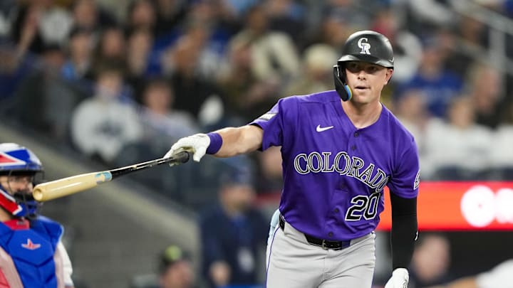 Mar 30, 2026; Toronto, Ontario, CAN;  Colorado Rockies Troy Johnston (20) hits a home rum against the Toronto Blue Jays during the sixth inning at Rogers Centre. Mandatory Credit: Kevin Sousa-Imagn Images