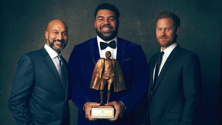 Cameron Hayward, Keegan-Michael Key and Prince Harry take a phone with the Walter Payton NFL Man of the Year Award
