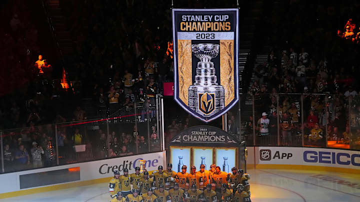 Oct 10, 2023; Las Vegas, Nevada, USA; The Vegas Golden Knights pose for a team photo in front of the 2023 Stanley Cup Champions banner before the start of a game against the Seattle Kraken at T-Mobile Arena. Mandatory Credit: Stephen R. Sylvanie-Imagn Images