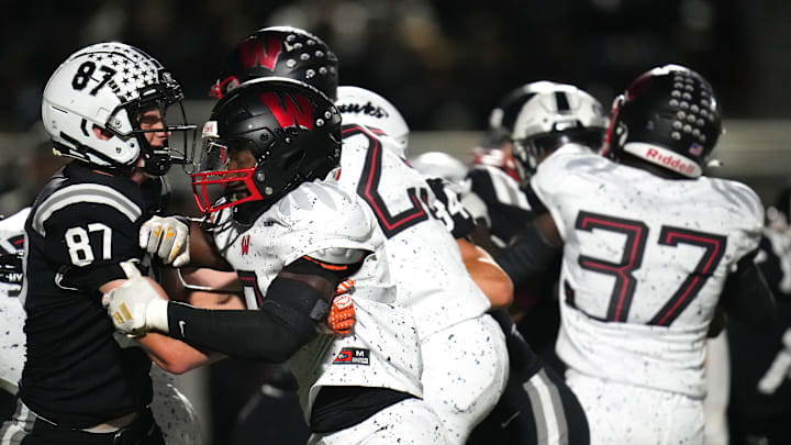 Lakota East Thunderhawks tight end PJ MacFarlane (87) blocks Lakota West Firebirds defensive end Bukari Miles (2) on a punt in the first half of a high school football game between the Lakota West Firebirds and the Lakota East Thunderhawks, Friday, Oct. 6, 2023, at Lakota East High School in Liberty Township, Ohio.