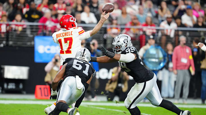 Jan 4, 2026; Paradise, Nevada, USA; Las Vegas Raiders defensive end Malcolm Koonce (51) and defensive tackle Thomas Booker IV (99) pressure Kansas City Chiefs quarterback Shane Buechele (17) during the fourth quarter at Allegiant Stadium. Mandatory Credit: Stephen R. Sylvanie-Imagn Images