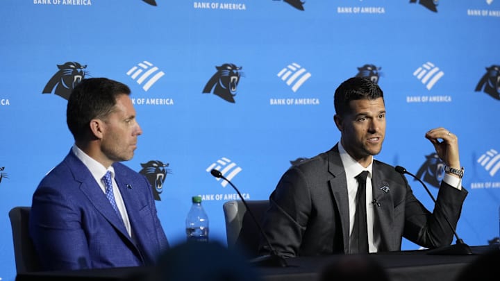 Feb 1, 2024; Charlotte, NC, USA;  Carolina Panthers head coach Dave Canales speaks to the media as general manager Dan Morgan looks on during the introductory press conference at Bank of America Stadium. Mandatory Credit: Jim Dedmon-Imagn Images