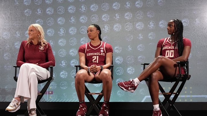 Oct 24, 2023; Charlotte, NC, USA; Florida State coach Brooke Wycoff with players Makayla Timson and