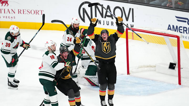 Jan 12, 2025; Las Vegas, Nevada, USA; Vegas Golden Knights left wing Pavel Dorofeyev (16) and Vegas Golden Knights right wing Victor Olofsson (95) celebrate after Vegas Golden Knights center Tomas Hertl (48) scored a goal against the Minnesota Wild during the third period at T-Mobile Arena. Mandatory Credit: Stephen R. Sylvanie-Imagn Images