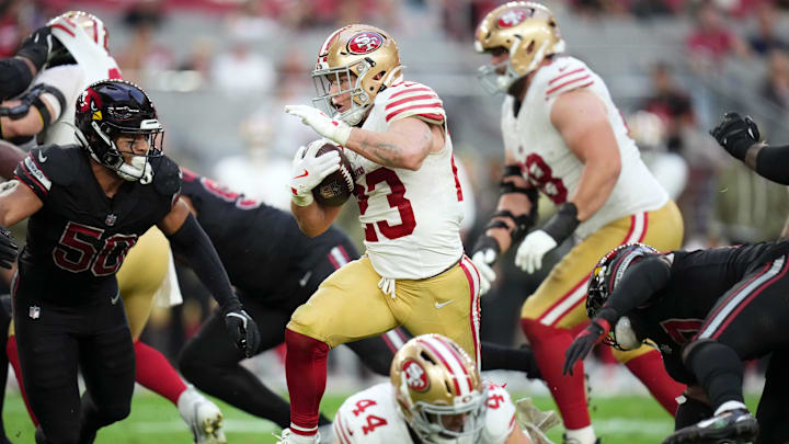 San Francisco 49ers running back Christian McCaffrey (23) breaks out of the backfield against the Arizona Cardinals at State Farm Stadium in Glendale on Nov. 16, 2025.