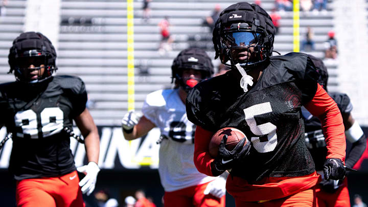 Cincinnati Bearcats safety D.J. Taylor (5) runs a punt and kick off return drill during the