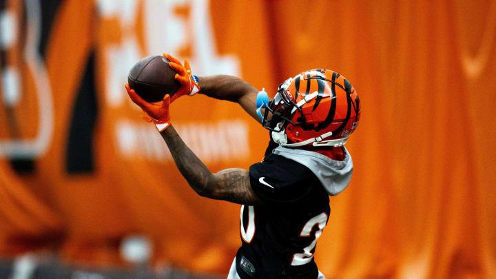 Cincinnati Bengals cornerback DJ Turner II (20) catches a pass during an interception drill at Bengals spring practice at the IEL Indoor Facility in Cincinnati on Tuesday, June 11, 2024. Cincinnati Bengals cornerback DJ Turner II (20) catches a pass during an interception drill at Bengals spring practice at the IEL Indoor Facility in Cincinnati on Tuesday, June 11, 2024.