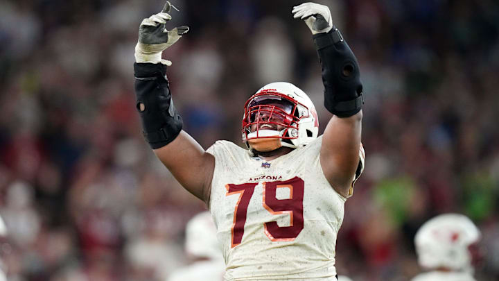 Arizona Cardinals defensive lineman PJ Mustipher (79) celebrates a stop against the Seattle Seahawks at State Farm Stadium in Glendale on Sept. 25, 2025.