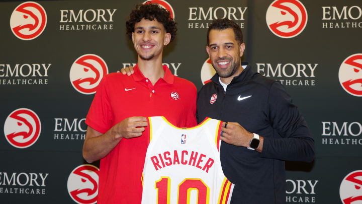 Jun 28, 2024; Atlanta, Georgia, USA; Atlanta Hawks first overall draft pick Zaccharie Risacher poses for a photo with general manager Landry Fields at the Emory Sports Medicine Complex. Mandatory Credit: Brett Davis-USA TODAY Sports
