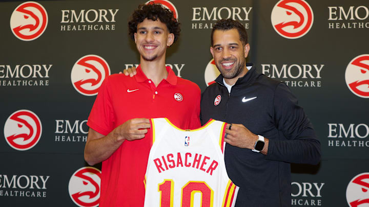 Jun 28, 2024; Atlanta, Georgia, USA; Atlanta Hawks first overall draft pick Zaccharie Risacher poses for a photo with general manager Landry Fields at the Emory Sports Medicine Complex. Mandatory Credit: Brett Davis-USA TODAY Sports