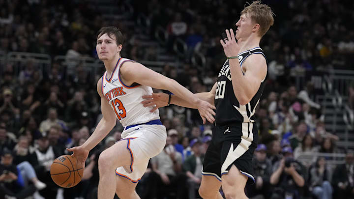 New York Knicks guard Tyler Kolek (13) drives to the basket against Milwaukee Bucks guard AJ Green (20)