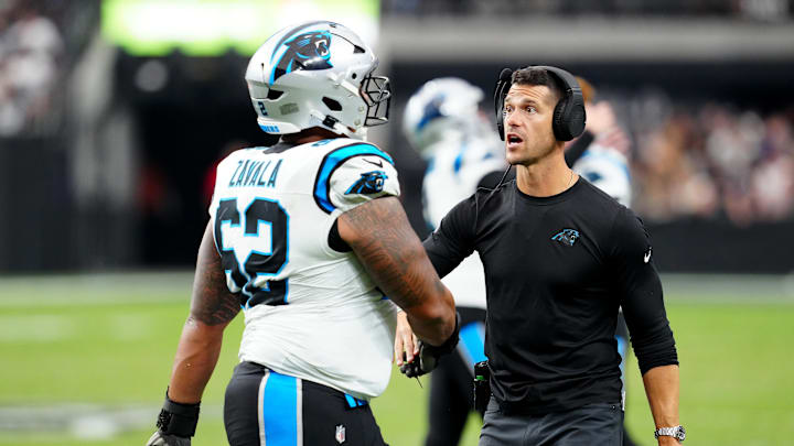 Carolina Panthers head coach Dave Canales and guard Chandler Zavala.