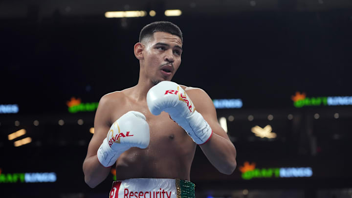 Diego Pacheco (white trunks) and Enrique Collazo (green trunks) box during their boxing bout at T-Mobile Arena. 
