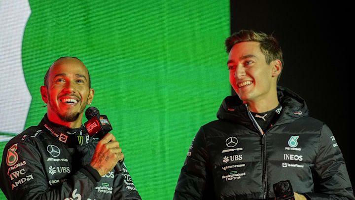 Nov 5, 2022; Las Vegas, Nevada, USA; Mercedes - AMG Petronas drivers Lewis Hamilton (left) and George Russell (right) during the Formula One Las Vegas Grand Prix Launch Party at Las Vegas Strip. Mandatory Credit: Ray Acevedo-Imagn Images