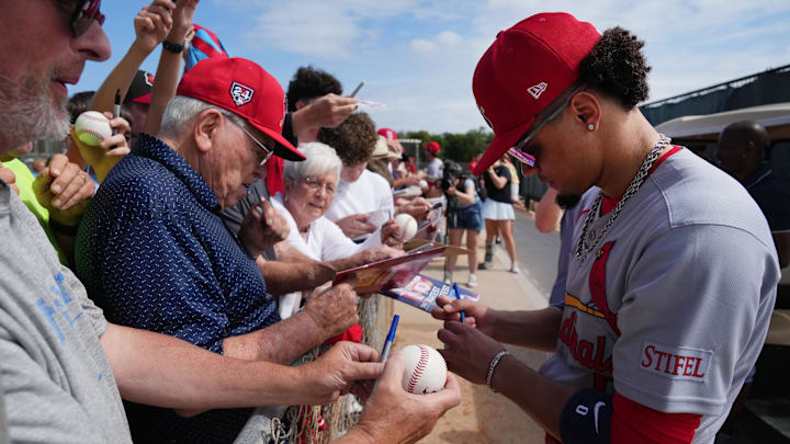 Feb 17, 2025; Jupiter, FL, USA; St. Louis Cardinals shortstop Masyn Winn (0) signs autographs at spring training. Mandatory Credit: Jim Rassol-Imagn Images Feb 17, 2025; Jupiter, FL, USA; St. Louis Cardinals shortstop Masyn Winn (0) signs autographs at spring training. Mandatory Credit: Jim Rassol-Imagn Images