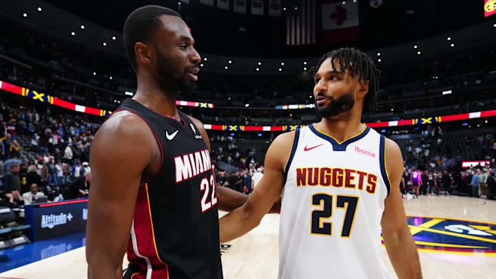 Nov 5, 2025; Denver, Colorado, USA; Miami Heat forward Andrew Wiggins (22) greets Denver Nuggets guard Jamal Murray (27) following the game at Ball Arena. Mandatory Credit: Ron Chenoy-Imagn Images
