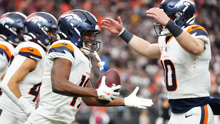 Dec 7, 2025; Paradise, Nevada, USA; Denver Broncos wide receiver Marvin Mims Jr. (19) reacts with teammates after scoring a touchdown on a punt return against the Las Vegas Raiders during the first half at Allegiant Stadium. Mandatory Credit: Stephen R. Sylvanie-Imagn Images Dec 7, 2025; Paradise, Nevada, USA; Denver Broncos wide receiver Marvin Mims Jr. (19) reacts with teammates after scoring a touchdown on a punt return against the Las Vegas Raiders during the first half at Allegiant Stadium. Mandatory Credit: Stephen R. Sylvanie-Imagn Images