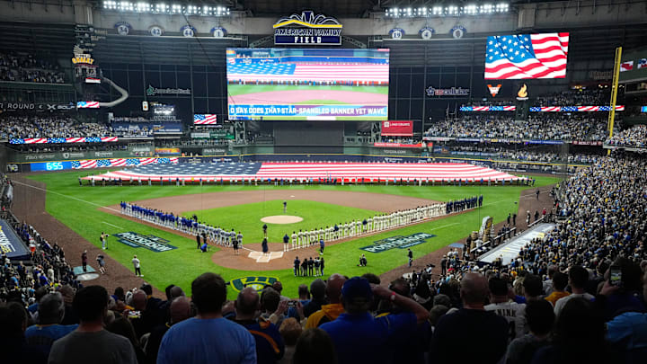 Oct 13, 2025; Milwaukee, Wisconsin, USA; A general view inside the stadium during the national anthem prior to game one of the NLCS round between the Milwaukee Brewers and the Los Angeles Dodgers for the 2025 MLB playoffs at American Family Field. Mandatory Credit: Michael McLoone-Imagn Images Oct 13, 2025; Milwaukee, Wisconsin, USA; A general view inside the stadium during the national anthem prior to game one of the NLCS round between the Milwaukee Brewers and the Los Angeles Dodgers for the 2025 MLB playoffs at American Family Field. Mandatory Credit: Michael McLoone-Imagn Images