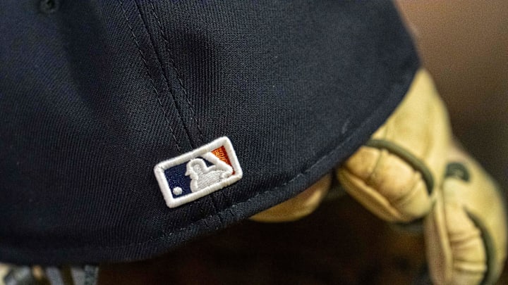 A general view of a Detroit Tigers hat with the Major League Baseball logo sitting in the dugout in a game against the Minnesota Twins at Target Field in 2025.