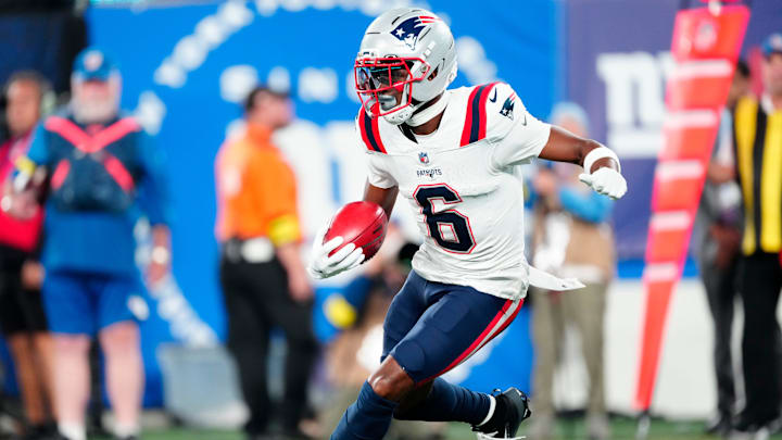New England Patriots wide receiver Javon Baker (6) runs with the punt return in the first quarter, Thursday, August 21, 2025, in East Rutherford.