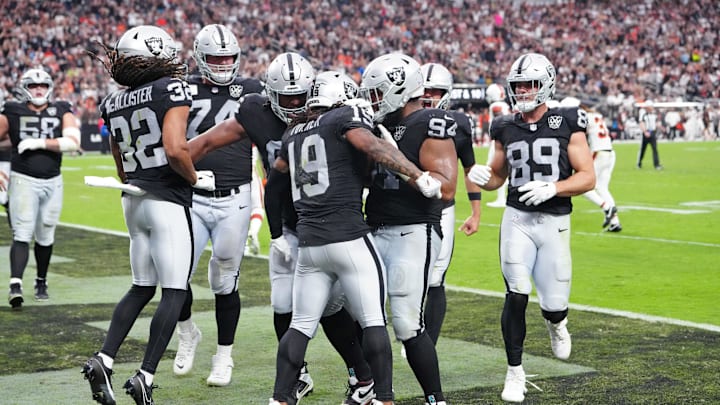 Sep 29, 2024; Paradise, Nevada, USA; Las Vegas Raiders wide receiver DJ Turner (19) celebrates with team mates after scoring a touchdown against the Cleveland Browns during the third quarter at Allegiant Stadium. Mandatory Credit: Stephen R. Sylvanie-Imagn Images